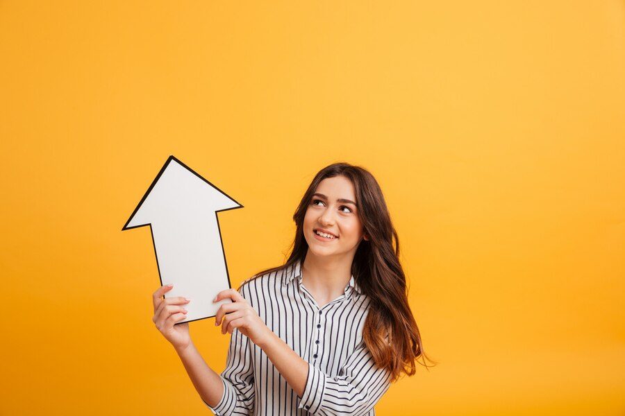 Yellow background featuring a woman with an upward arrow symbolizing boosted ROI through PPC campaigns with Expresso Company.