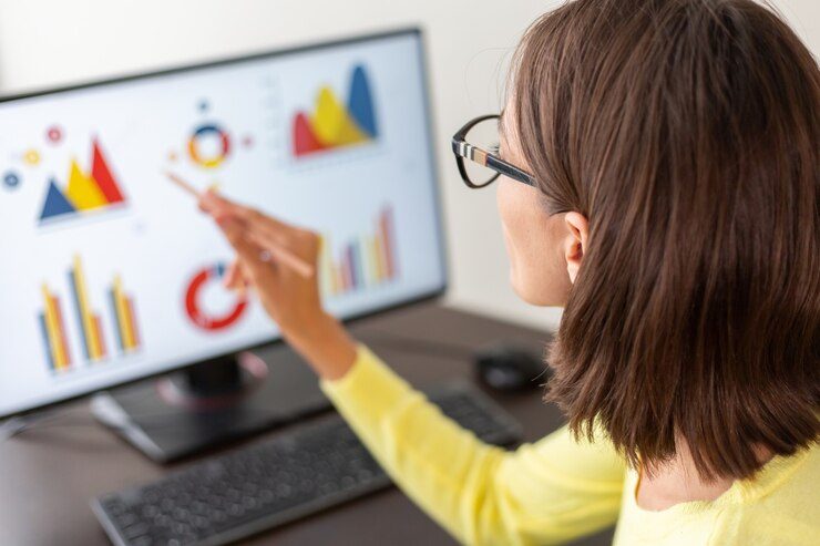 Woman analyzing data on her computer to optimize her e-commerce website jewerly store using data analytics