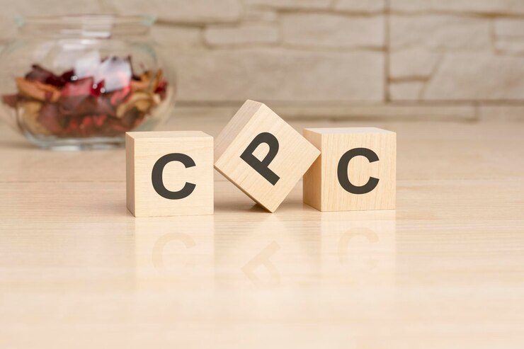 CPC wooden blocks symbolizing cost-per-click strategies in Google Ads campaigns.