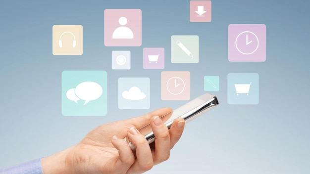 Hand holding a smartphone with floating icons representing various communication tools for customer engagement.