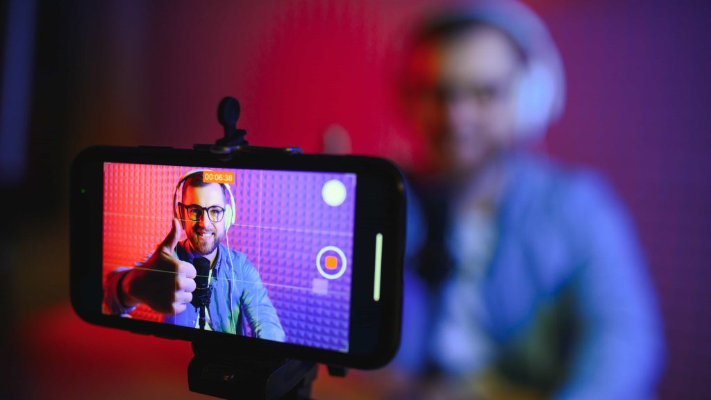Content creator recording a video for social media to improve AI search visibility like ChatGPT