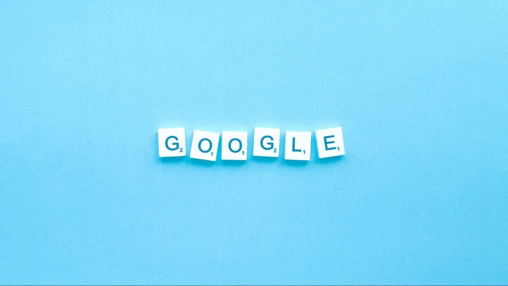 Scrabble tiles spelling Google on a blue background, representing SEO and search ranking goals for 2025 content marketing.