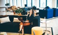 happy-businesswoman-talking-on-the-phone-in-modern-office--q25s16vo6miljauc5l1tq4fw2cux2ncxj89t56rq28